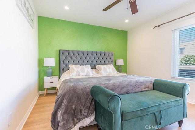 18350 Hatteras St Unit 169, Tarzana, CA 91356 - bedroom with wood finished floors, recessed lighting, baseboards, a ceiling fan, and an accent wall