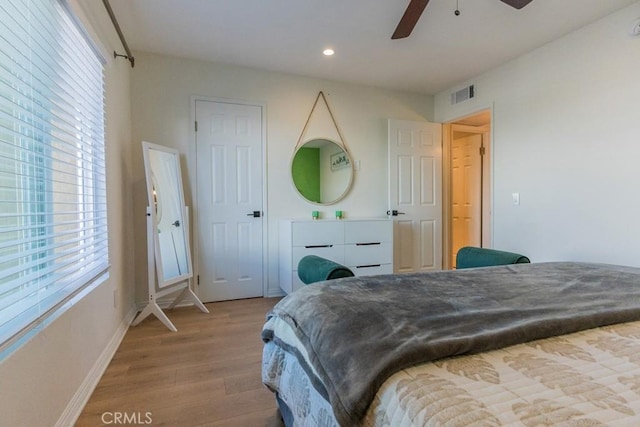 18350 Hatteras St Unit 169, Tarzana, CA 91356 - bedroom with wood finished floors, multiple windows, recessed lighting, baseboards, and ceiling fan