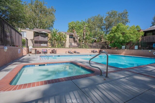 18350 Hatteras St Unit 169, Tarzana, CA 91356 - community pool featuring a patio and a hot tub