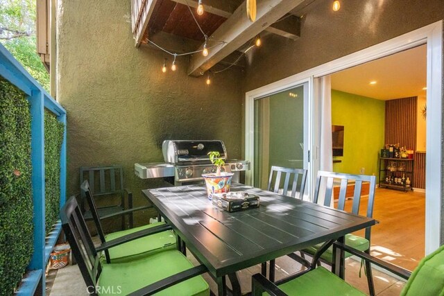 18350 Hatteras St Unit 169, Tarzana, CA 91356 - balcony with a grill and outdoor dining area