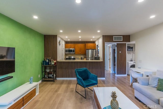 18350 Hatteras St Unit 169, Tarzana, CA 91356 - living area featuring washer / clothes dryer, light wood-type flooring, and recessed lighting