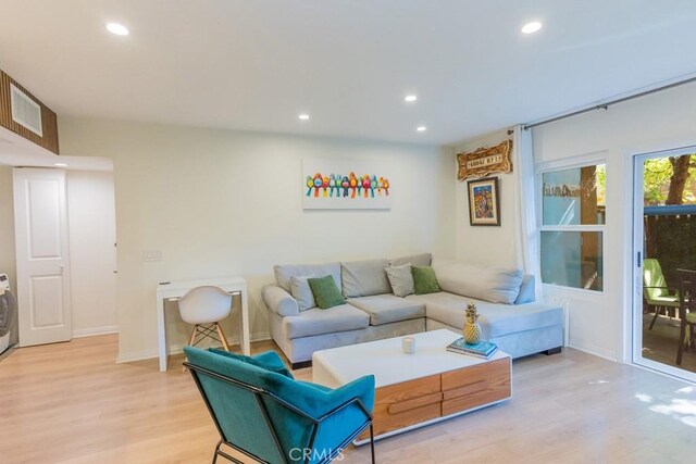 18350 Hatteras St Unit 169, Tarzana, CA 91356 - living room with light wood-style flooring, recessed lighting, washer / dryer, and baseboards