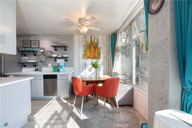 100 Atlantic Ave Unit 603, Long Beach, CA 90802 - kitchen with stainless steel dishwasher, ceiling fan, light countertops, a sink, and light wood-style floors