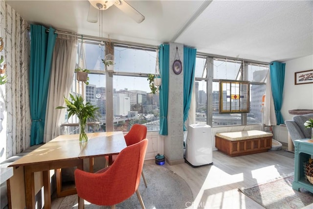 100 Atlantic Ave Unit 603, Long Beach, CA 90802 - dining area with ceiling fan and light wood finished floors