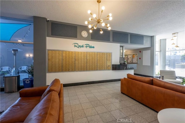 100 Atlantic Ave Unit 603, Long Beach, CA 90802 - reception area with a chandelier, a textured ceiling, and a surveillance system