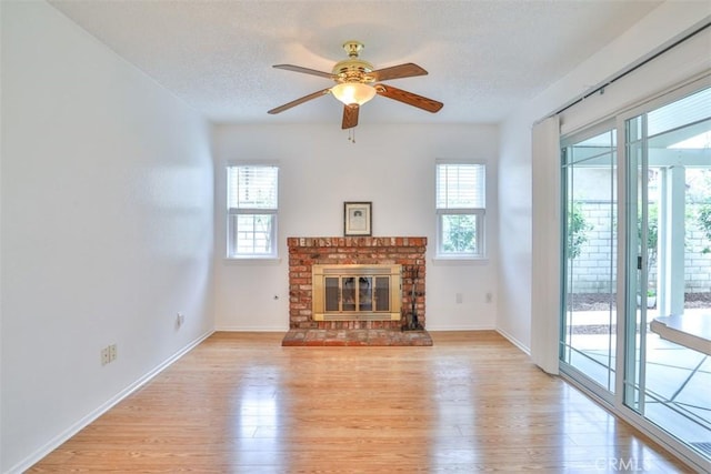 10249 Candlewood St, Rancho Cucamonga, CA 91730 - unfurnished living room featuring plenty of natural light, light wood finished floors, a textured ceiling, and baseboards