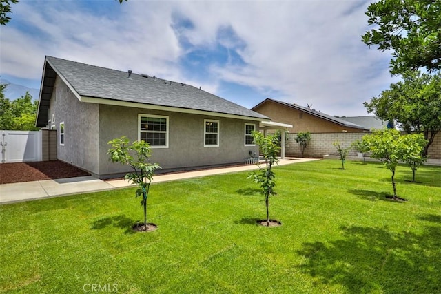 10249 Candlewood St, Rancho Cucamonga, CA 91730 - rear view of property featuring stucco siding and roof with shingles