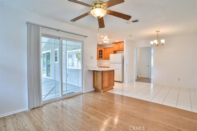 10249 Candlewood St, Rancho Cucamonga, CA 91730 - unfurnished living room featuring a chandelier, light wood-style floors, ceiling fan, and baseboards