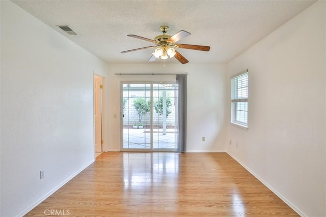10249 Candlewood St, Rancho Cucamonga, CA 91730 - spare room with ceiling fan, light wood-style floors, baseboards, and a textured ceiling