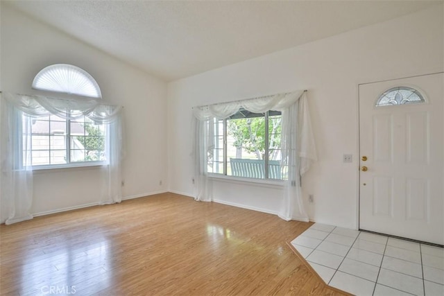 10249 Candlewood St, Rancho Cucamonga, CA 91730 - entrance foyer featuring plenty of natural light, wood finished floors, and baseboards