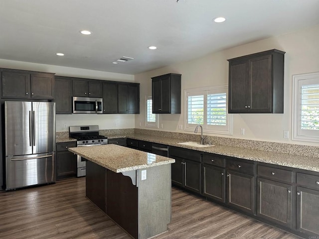 253 Oberland Way, Fallbrook, CA 92028 - kitchen featuring stainless steel appliances, a sink, plenty of natural light, light stone countertops, and recessed lighting
