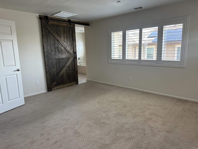 253 Oberland Way, Fallbrook, CA 92028 - unfurnished bedroom featuring carpet flooring, baseboards, and a barn door