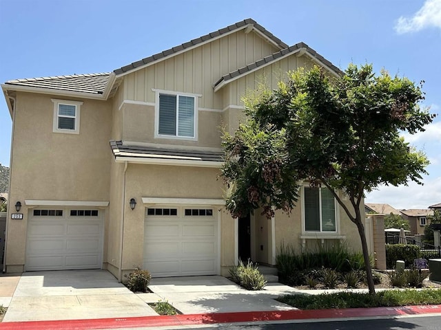 253 Oberland Way, Fallbrook, CA 92028 - traditional-style home with an attached garage, a tiled roof, stucco siding, driveway, and board and batten siding