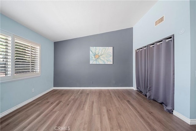 6597 Kinlock Ave, Rancho Cucamonga, CA 91737 - empty room with wood finished floors and baseboards