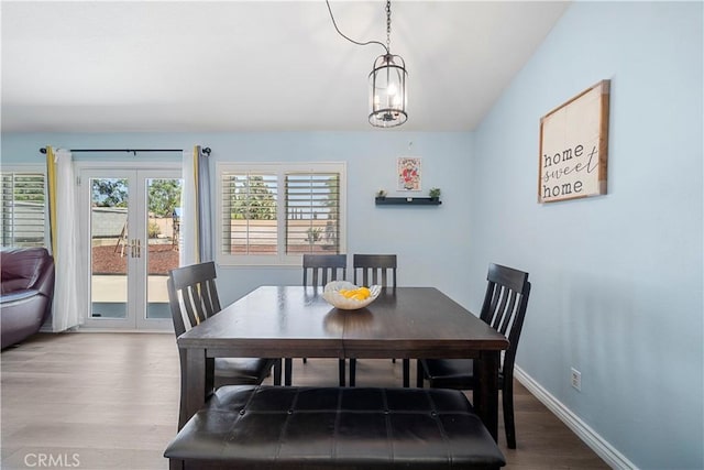 6597 Kinlock Ave, Rancho Cucamonga, CA 91737 - dining space featuring wood finished floors, baseboards, and french doors
