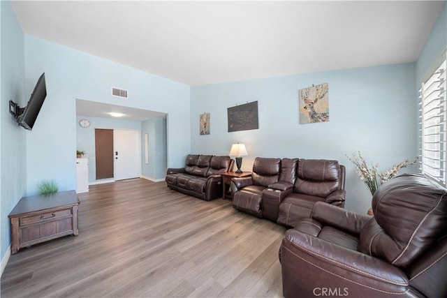 6597 Kinlock Ave, Rancho Cucamonga, CA 91737 - living room featuring wood finished floors and baseboards
