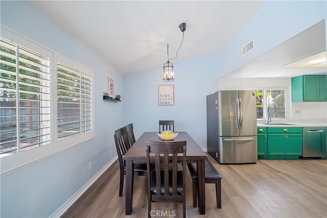 6597 Kinlock Ave, Rancho Cucamonga, CA 91737 - dining space with light wood-type flooring and baseboards