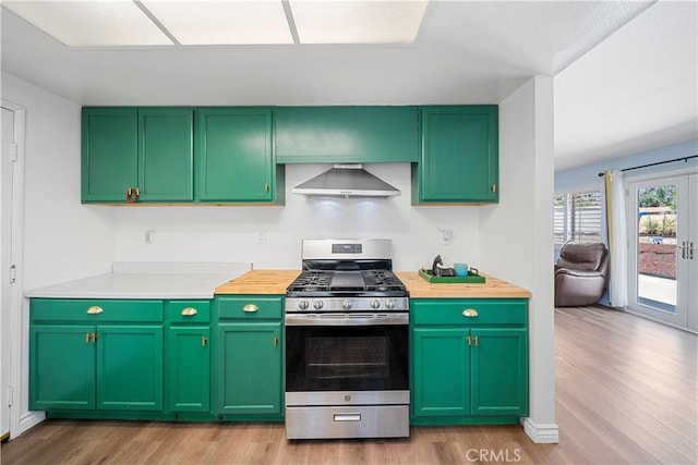 6597 Kinlock Ave, Rancho Cucamonga, CA 91737 - kitchen with stainless steel range with gas cooktop, wall chimney exhaust hood, light wood finished floors, and green cabinetry