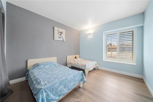 6597 Kinlock Ave, Rancho Cucamonga, CA 91737 - bedroom featuring baseboards and wood finished floors