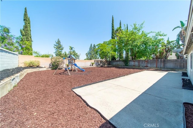 6597 Kinlock Ave, Rancho Cucamonga, CA 91737 - fenced backyard with a playground and a patio