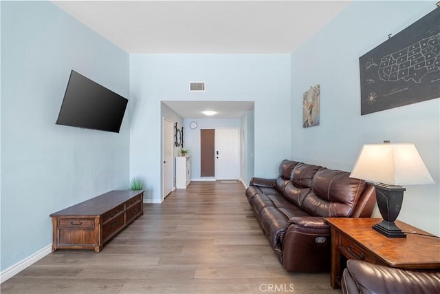 6597 Kinlock Ave, Rancho Cucamonga, CA 91737 - living area featuring light wood-style flooring and baseboards