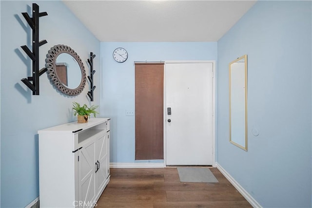 6597 Kinlock Ave, Rancho Cucamonga, CA 91737 - entryway featuring dark wood-style floors and baseboards
