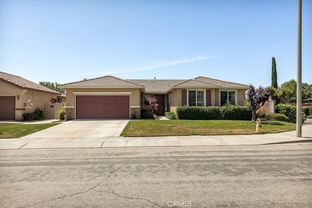 1467 Hunter Moon Way, Beaumont, CA 92223 - view of front of home with an attached garage, concrete driveway, a front lawn, stucco siding, and a tile roof