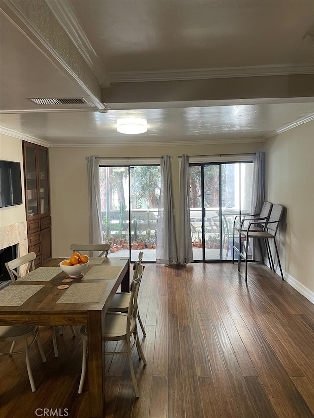404 Brighton Spgs, Costa Mesa, CA 92627 - dining space featuring wood-type flooring, a fireplace, baseboards, and ornamental molding