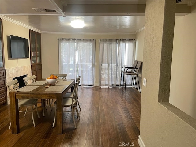 404 Brighton Spgs, Costa Mesa, CA 92627 - dining area featuring dark wood-style flooring, crown molding, and a textured wall