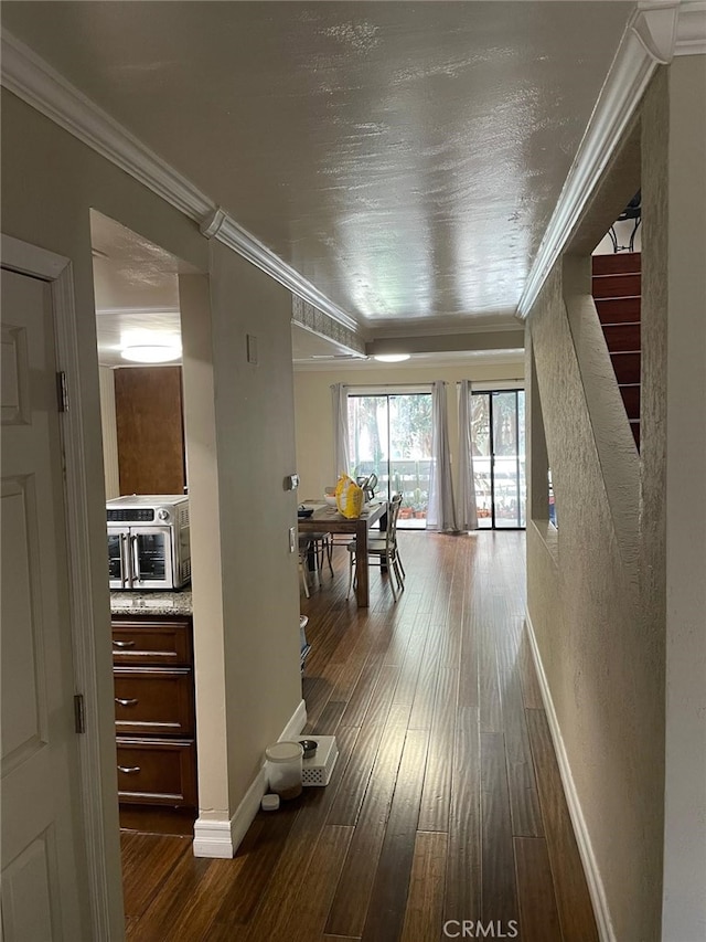 404 Brighton Spgs, Costa Mesa, CA 92627 - hall with ornamental molding, stairs, dark wood finished floors, and baseboards
