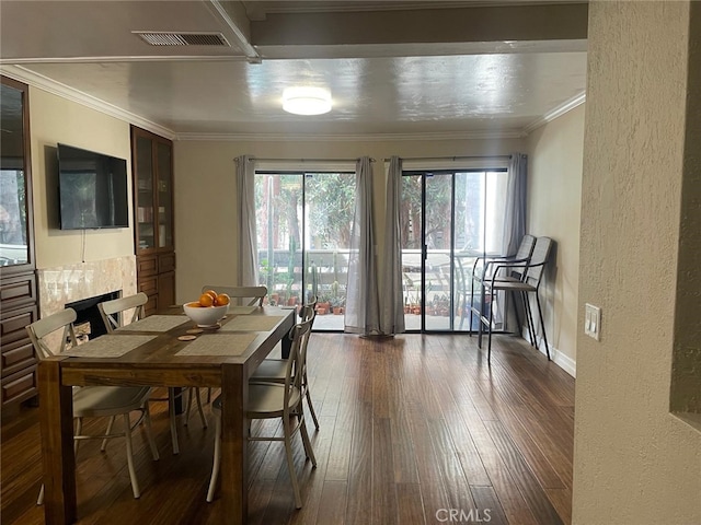 404 Brighton Spgs, Costa Mesa, CA 92627 - dining area featuring a textured wall, dark wood finished floors, and crown molding