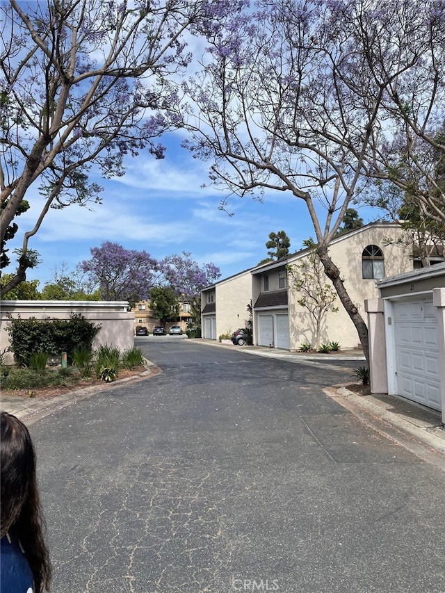 404 Brighton Spgs, Costa Mesa, CA 92627 - view of asphalt road featuring curbs