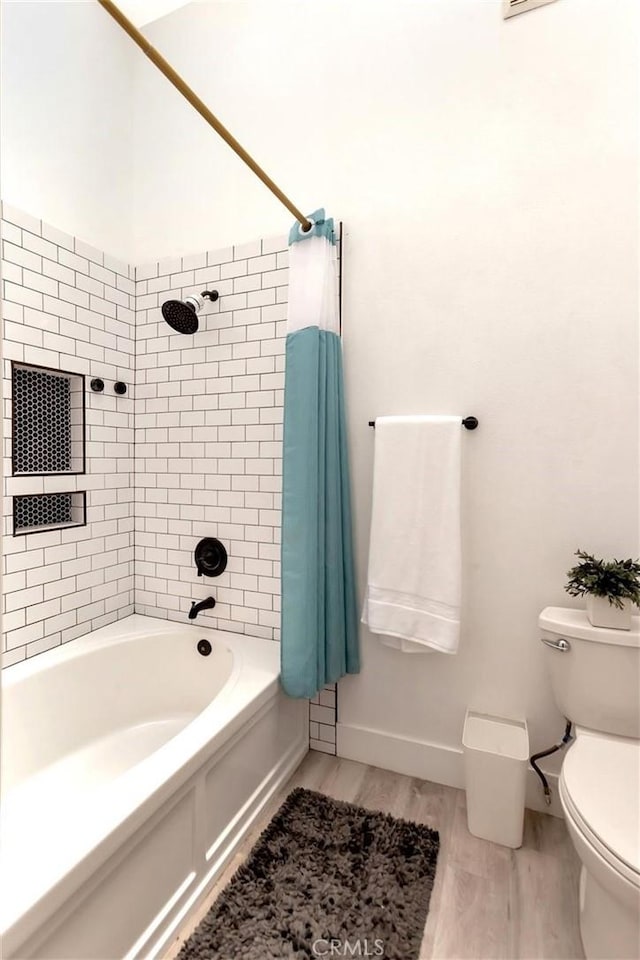 32457 Spyglass Ct, San Juan Capistrano, CA 92675 - full bathroom with toilet, shower / bathtub combination with curtain, baseboards, and wood finished floors