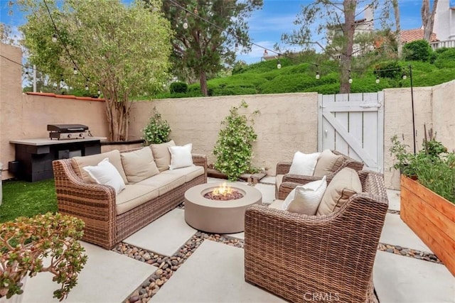 32457 Spyglass Ct, San Juan Capistrano, CA 92675 - view of patio / terrace featuring a gate and an outdoor living space with a fire pit