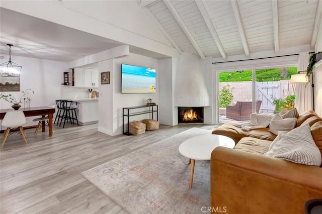 32457 Spyglass Ct, San Juan Capistrano, CA 92675 - living area with light wood-style floors, a large fireplace, wooden ceiling with exposed beams, high vaulted ceiling, and baseboards
