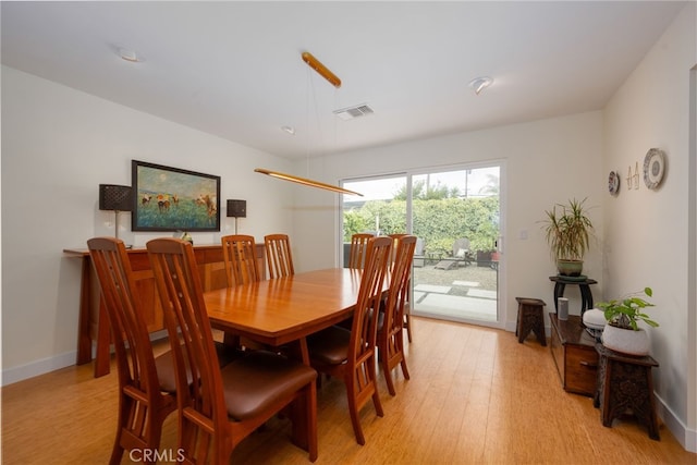 6017 Carnegie St, San Diego, CA 92122 - dining area with light wood-style flooring and baseboards