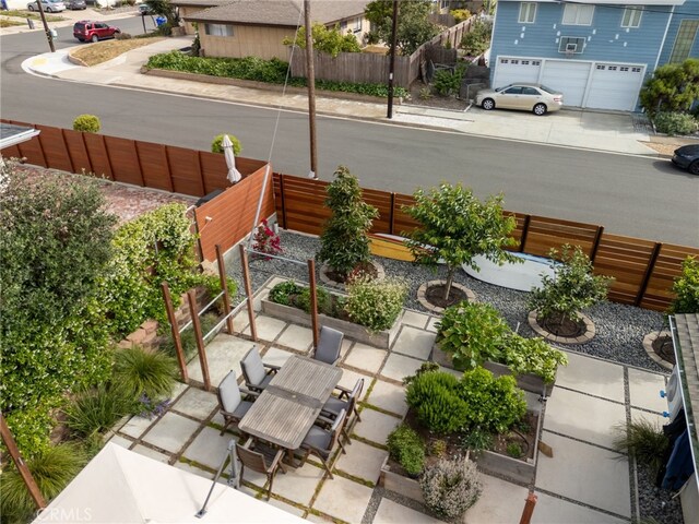 6017 Carnegie St, San Diego, CA 92122 - view of patio with a garage and concrete driveway