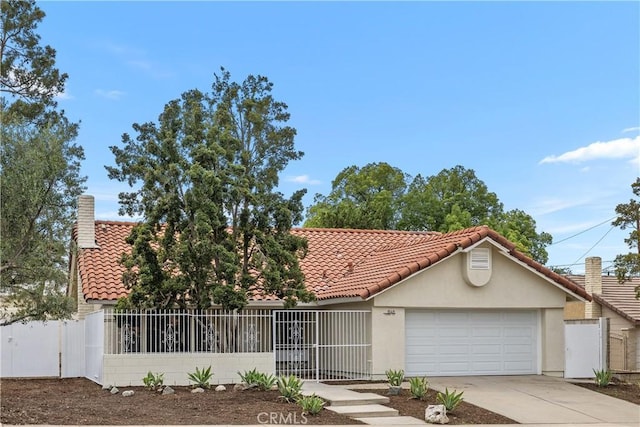 1348 Sandia St, Corona, CA 92882 - view of front facade featuring a tile roof, stucco siding, concrete driveway, and a chimney