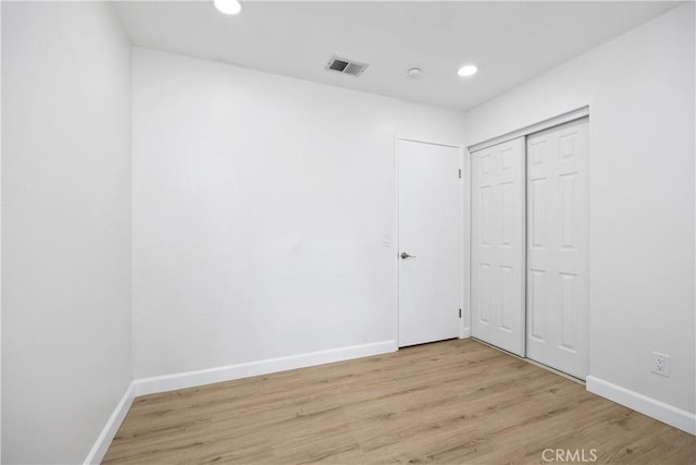 1348 Sandia St, Corona, CA 92882 - unfurnished bedroom with light wood-style flooring, baseboards, recessed lighting, and a closet