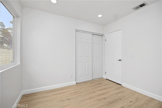 1348 Sandia St, Corona, CA 92882 - unfurnished bedroom featuring light wood finished floors, baseboards, recessed lighting, and a closet