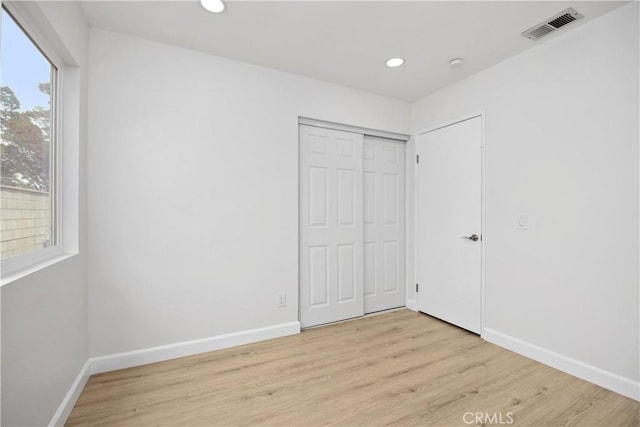 1348 Sandia St, Corona, CA 92882 - unfurnished bedroom featuring light wood-style floors, recessed lighting, and a closet