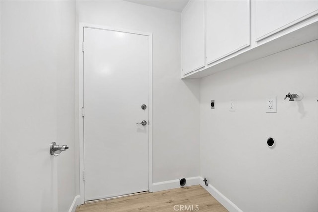 1348 Sandia St, Corona, CA 92882 - laundry area featuring cabinet space, hookup for an electric dryer, light wood finished floors, baseboards, and washer hookup