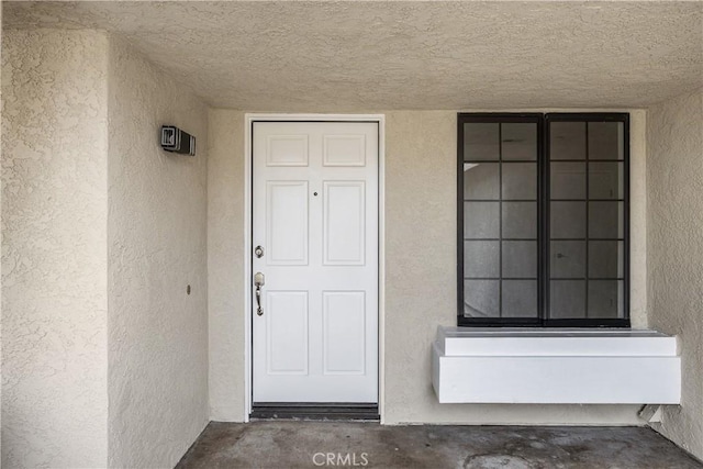1348 Sandia St, Corona, CA 92882 - doorway to property featuring stucco siding