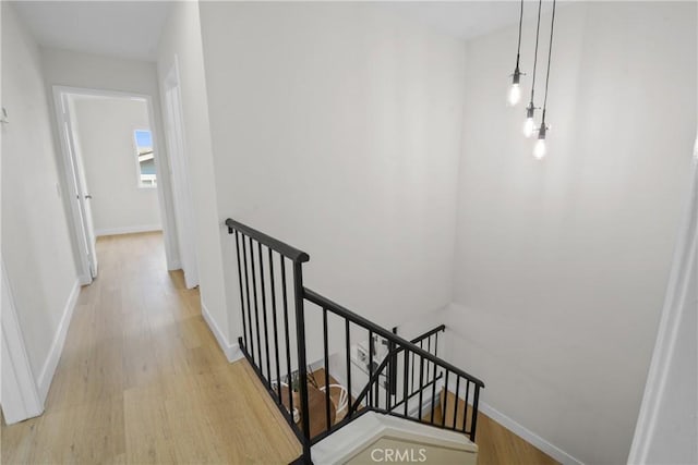 921 Boon Pl Unit A, Corona, CA 92881 - corridor with an upstairs landing, wood finished floors, and baseboards