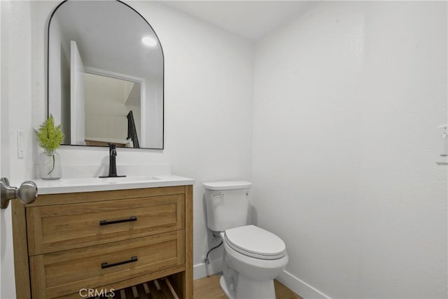 921 Boon Pl Unit A, Corona, CA 92881 - half bathroom with vanity, toilet, and baseboards