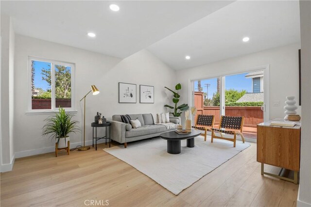 921 Boon Pl Unit A, Corona, CA 92881 - living room featuring light wood-style floors, baseboards, lofted ceiling, and recessed lighting