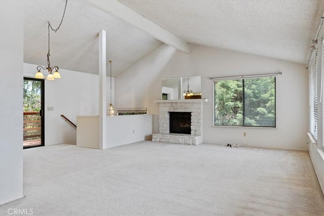 645 Worcester Dr, Cambria, CA 93428 - unfurnished living room featuring carpet, a chandelier, plenty of natural light, and a textured ceiling