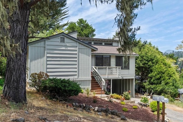 645 Worcester Dr, Cambria, CA 93428 - view of front of home featuring stairs and roof with shingles