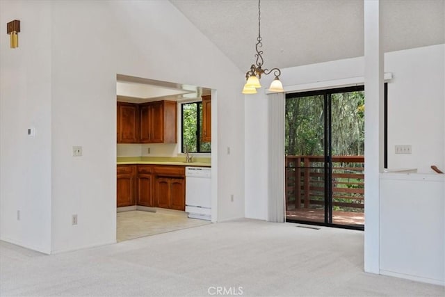 645 Worcester Dr, Cambria, CA 93428 - unfurnished dining area with light colored carpet and vaulted ceiling