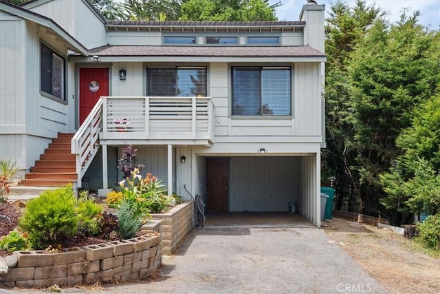 645 Worcester Dr, Cambria, CA 93428 - townhome / multi-family property featuring driveway, a garage, a chimney, and roof with shingles